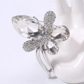 Detail of crystal butterfly brooch with marquise and pear shaped gems on hand model - White