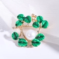 Detailed macro view of green enamel leaves and white pearl on gold floral brooch - White Artificial Pearl Style (MM-BR-3169) / White (MM-BR-3169)