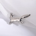 Minimalist silver fox brooch pin in a running pose on delicate white fabric - Silver