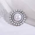 Elegant vintage silver brooch with concentric pearl circles and a large center pearl - Silver