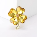 Macro shot of yellow crystal clover brooch with gold finish and faceted petals - Heart Clover (3187) / Yellow