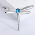 Vintage dragonfly brooch with silver alloy wings and a rectangular blue gemstone center - Silver