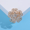 Sparkling gold flower brooch with crystal rhinestones and hollow heart petals - Gold