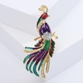 Macro shot of colorful peacock brooch with crystal rhinestones and enamel details - Purple