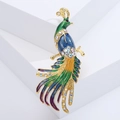 Macro detail of luxury peacock brooch with green enamel and sparkling rhinestones - Blue