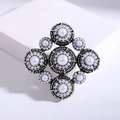 Vintage Baroque pearl brooch with silver antique finish and radial symmetry design - Silver