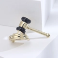 Macro detail of alloy gavel brooch with black enamel inlay on white stand - Gold (3235)