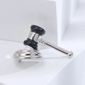 Detailed macro view of silver alloy gavel brooch with black enamel inlay and polished finish - Silver (3235)