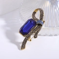 Spilla a fiocco vintage con grande cristallo blu scuro e dettagli in strass grigi - Blu