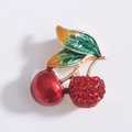 Detailed view of cherry brooch with red enamel and sparkling crystal rhinestones - Red