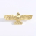 Detailed close-up of a gold eagle brooch with star-engraved bar and polished metal finish - Gold
