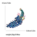 Squisita spilla a pavone in cristallo con strass blu e dettagli floreali in smalto - Blu (MM-BR-3279)
