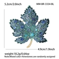 Elegant maple leaf brooch with blue gradient rhinestones on a gold-plated base - Blue