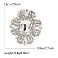 Elegante spilla dorata con grande cristallo rettangolare e strass luminosi e chiari - Oro