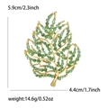 Golden leaf brooch with green rhinestones and detailed leaf veins on white background - Green (3366-GN)