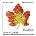 Elegant maple leaf brooch with orange and yellow crystals on a gold-tone metal base - Orange Red