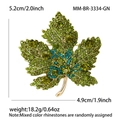Elegant maple leaf brooch with green rhinestones in gold alloy for suits, 5.2x4.9cm size - Green