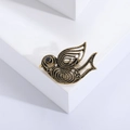 Vintage hollow gold bird brooch with intricate metal textures and black gem eye detail - Gold