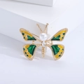 Eleganter goldfarbener Schmetterlings-Brosche mit grünem Emaille und Perlenakzent - Grün