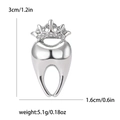 Silver crown tooth brooch with white rhinestones in a polished metal finish - Silver