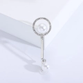 Detailed view of silver key brooch featuring micro-pave crystals and elegant white pearls - Silver