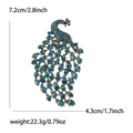 Pfau-Brosche Maße 7,2 cm x 4,3 cm mit Vintage-Metall und blauen Strasssteinen - Pfauenblau