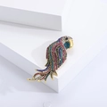 Detailed macro view of gold parrot brooch with colorful rhinestones on white stands - Small / Rainbow Small