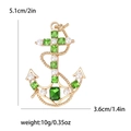 Vintage gold anchor brooch with emerald green crystals and white pearls, size 5.1cm - Green