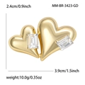 Spilla a doppio cuore dorato con zirconi, dimensioni 3,9cm x 2,4cm e peso 10 grammi - Oro