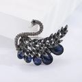 Elegant swan brooch with deep blue crystals and smoky grey rhinestones on silver metal - Blue