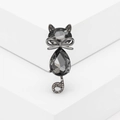 Elegant crystal cat brooch with bowknot and pavé rhinestones on minimalist white display - Gray