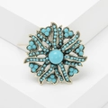 Broche de flor vintage con cuentas turquesas y diseño floral en acabado oro antiguo - Azul Turquesa