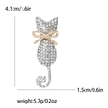 Spilla a gatto con strass bianchi e fiocco d'oro, dimensioni 4,1 cm per 1,5 cm - Argento