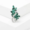 Elegant emerald crystal leaf brooch with silver base on minimalist white stone background - Green (MM-BR-Green-3536-GN)