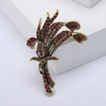 Vintage gold bouquet brooch with red rhinestones in an elegant spray design - Red