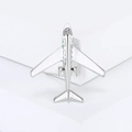 Creative airplane brooch with white enamel and sparkling rhinestones on a minimalist block - Silver