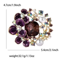 Luxury flower brooch with purple enamel petals, brown gemstone, and gold plating - Purple
