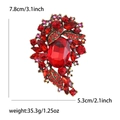 Vintage red crystal oval brooch in bronze alloy finish with ruby rhinestones - Red