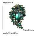 Vintage oversized emerald crystal brooch with oval green stone in antique gold setting - Green