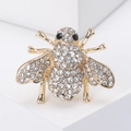 Squisita spilla ad ape dorata con strass bianchi e occhi in pietre preziose nere - Oro