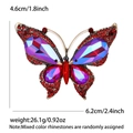 Elegante broche de mariposa dorado con cristales rojos y piedras preciosas violetas - Rojo