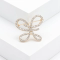 Sparkling crystal butterfly brooch in gold-plated metal for elegant suit jackets - Bow / Gold