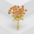 Elegante spilla a bouquet di fiori dorati con strass champagne e foglie smaltate - Champagne