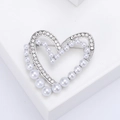 Elegant heart brooch with pearls and crystals on minimalist silver display stand - Silver