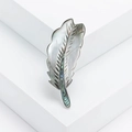 Elegant natural mother-of-pearl feather brooch with abalone shell inlay on white blocks - Green