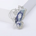 Detail of blue enamel butterfly brooch with white rhinestones on wings and body - Silver Base Blue