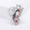 Detailed macro view of purple enamel butterfly brooch with inlaid rhinestones and silver finish - Silver Base Red