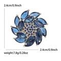 Broche fleur rotative en zircon avec cristaux marquise bleus et finition dorée - Bleu