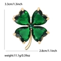 Gold-rimmed four-leaf clover brooch with heart-cut green crystal stones and small drill - Green