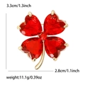Elegant red crystal four-leaf clover brooch in gold finish with precise measurements - Red